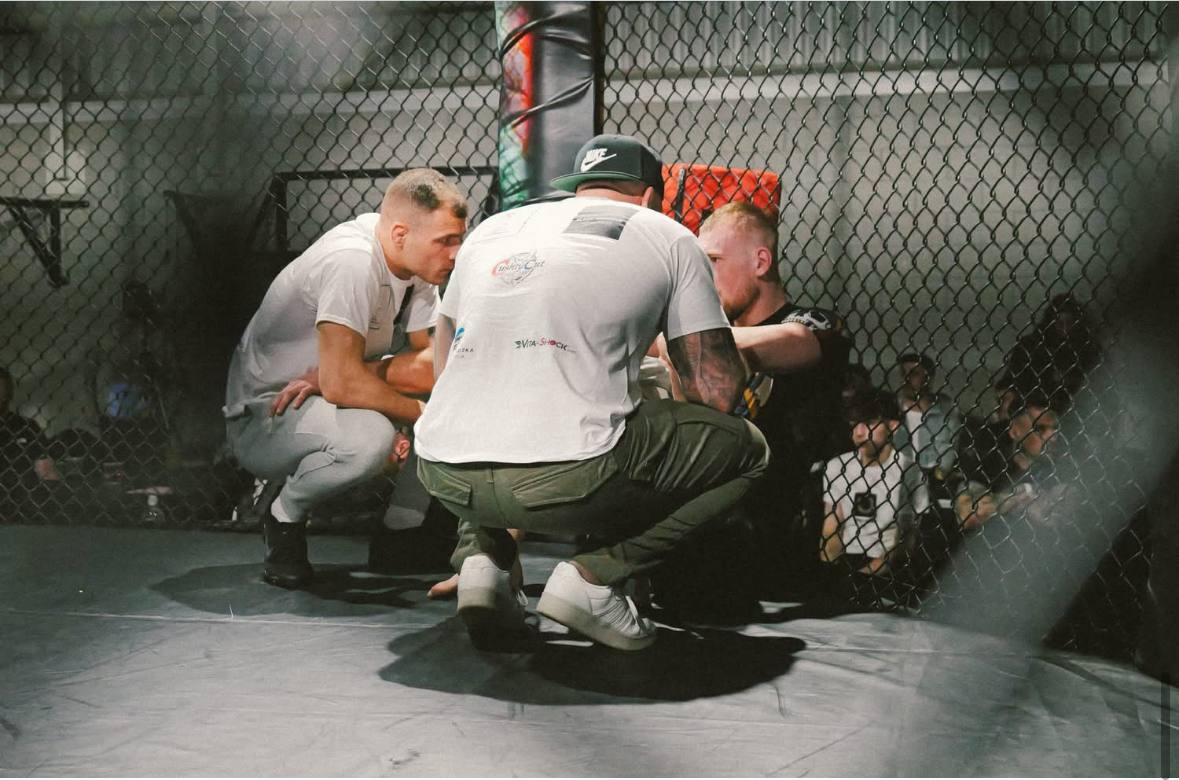 Coaching from the cage corner during a fight