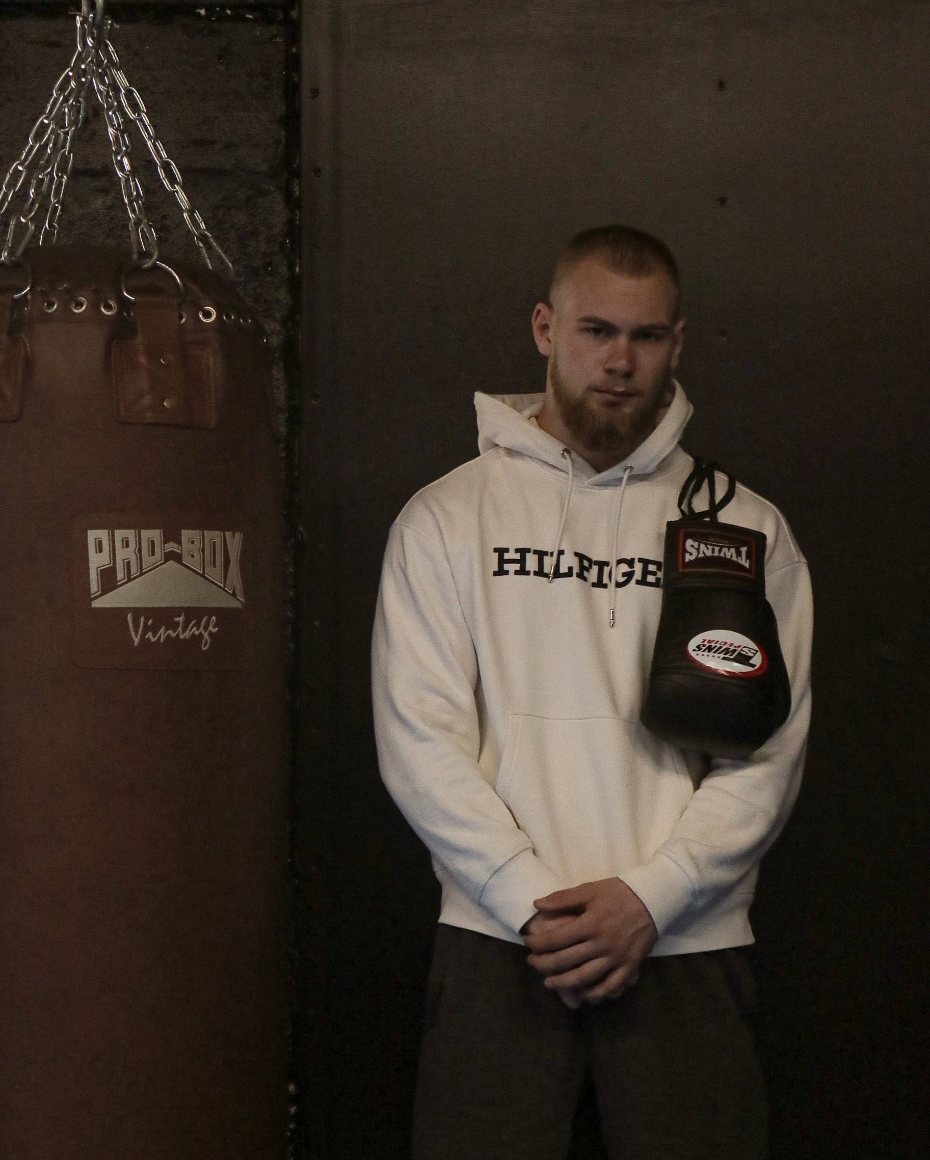 Mark posing with boxing gloves at the gym
